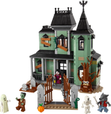 LEGO haunted mansion set with monsters on white background