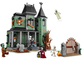 LEGO haunted house set with characters and accessories on a white background