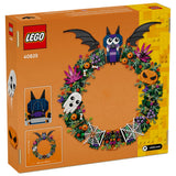 LEGO 40825 Halloween Wreath building set box, featuring an orange box with a colorful illustration of a decorated wreath with a bat, ghost, spiderwebs, and pumpkins.