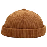 Brown corduroy beanie on a white background
