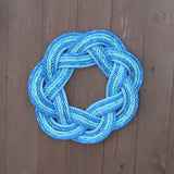 Blue rope knot wreath on a wooden door