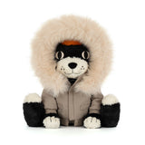 Black and white plush cat toy wearing a khaki parka with fur trim.