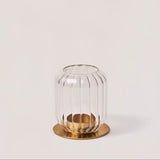One clear borosilicate glass lantern candle holder with brass finish metal bases.