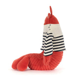 Plush toy lobster wearing a striped shirt on a white background
