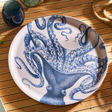 Round tray with blue octopus design on a wooden surface