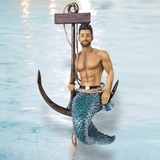 Mermaid figure with anchor against a water background