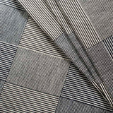 Close-up of a textured fabric with geometric pattern