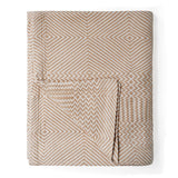 Beige blanket with geometric pattern on a white background