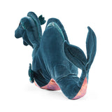 Blue plush toy resembling a dragon on a white background