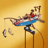Toy boat with figures on a stand against a yellow background