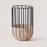A medium-sized kitchen utensil holder with a minimal design, featuring natural rattan on a powder-coated iron frame.