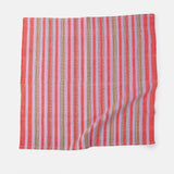 A set of striped cotton napkins in pink and white, displayed on a white background.