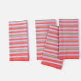 A set of striped cotton napkins in pink and white, displayed on a white background.
