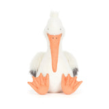 Stuffed pelican toy with a white body, orange beak, and feet on a white background
