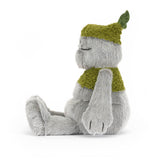 Plush toy with a green hat and shirt on a white background