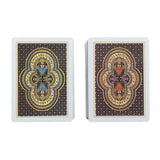 Two stacks of playing cards with Ethiopian-inspired artwork on a colorful geometric background.