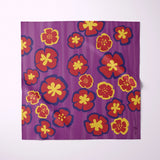 A square fabric item featuring a retro floral pattern with red and yellow flowers on a textured purple background, displayed flat against a light gray backdrop.