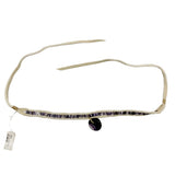 Beige leather necklace with white and purple shell beads on a white background