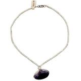 Necklace with a purple and white shell pendant on a white background