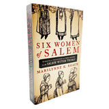 Book titled 'Six Women of Salem' by Marilynne K. Roach on a white background
