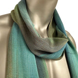 Mannequin wearing a green and blue scarf