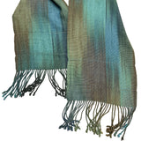 Green and blue scarf with fringes on a white background