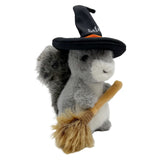 Plush toy squirrel in a witch costume with a broom on a white background