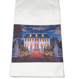 Tea towel with a printed design of a house at night on a white background