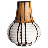 Hand turned wood vase with a white bottom half and black ink drips down the sides