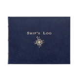A navy blue hardcover book 'Ship's Log' with a gold compass rose illustration on the front, shown against a plain white background.