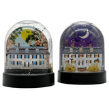 Two decorative snow globes with house illustrations on a white background