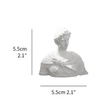 White bust sculpture with dimensions indicated on a white background