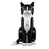 Black and white cat-shaped building block set on a white background