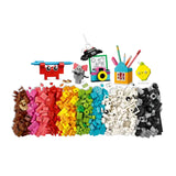 Assorted building blocks and mini figures on a white background