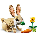 LEGO rabbit with carrot and sunflower on a white background