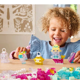 Child playing with colorful building blocks on a table