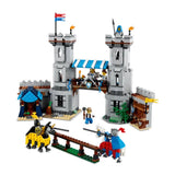 LEGO castle set with towers, flags, and figures on a white background