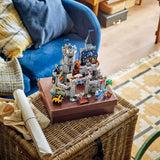 Toy castle on a book with a cozy living room background