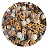 Assorted snack mix with various textures and colors in a circular container.