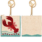 Beaded coin purse with red lobster design on a white background