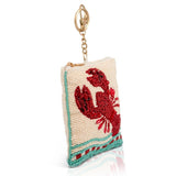 Beaded coin purse with red lobster design on a white background