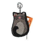Cat-shaped beaded keychain coin purse with rhinestone details on a white background