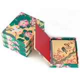 Set of notebooks with floral and bird design on a white background