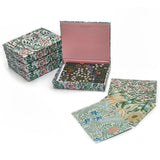 Set of floral-patterned boxes and notebooks on a white background