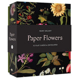 Box of Mary Delany Paper Flowers with floral designs on a black background