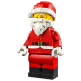 A LEGO Santa minifigure with a red suit, white beard and hat trim, yellow head, and black boots, isolated on a white background.