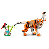 LEGO tiger model with a small bird and tree on a white background