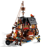 Toy pirate ship model with detailed architecture and figures on a white background