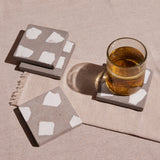 Set of four handcrafted Terrazzo Coasters in neutral colors.
