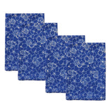 Set of four blue cloth napkins with white patterns on a white background